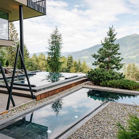 My Arbor - Dolomites Hotel Bressanone Kültér fotó A private swimming pool in the Alps