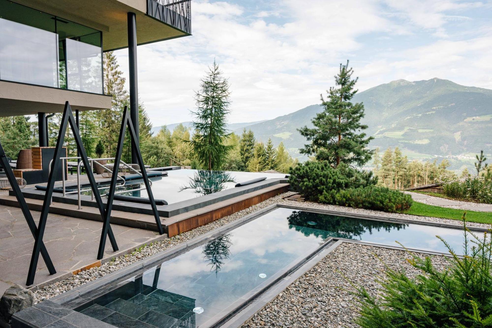 My Arbor - Dolomites Hotel Bressanone Kültér fotó A private swimming pool in the Alps